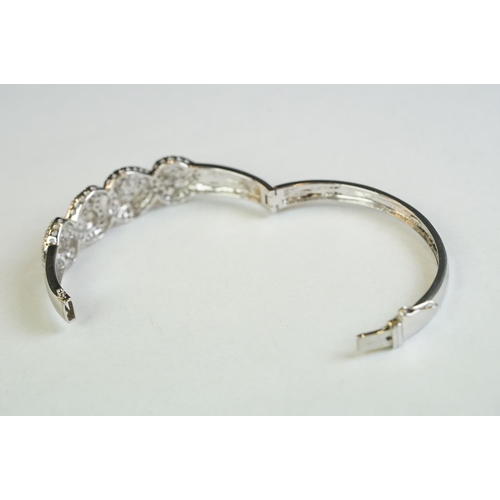 187 - A silver and CZ heart set bangle