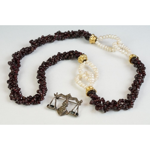 189 - A garnet and natural pearl necklace together with a white metal marcasite brooch in the form of scal... 