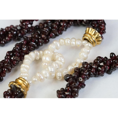 189 - A garnet and natural pearl necklace together with a white metal marcasite brooch in the form of scal... 