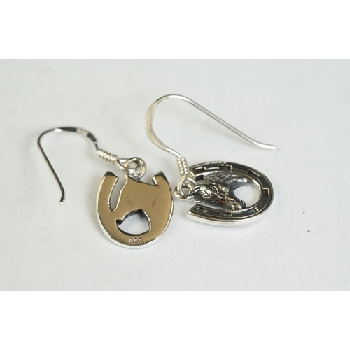 191 - A pair of silver horseshoe drop earrings