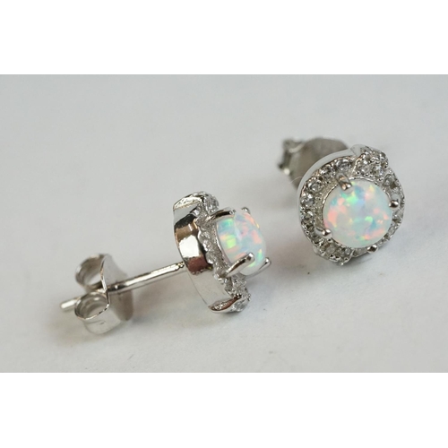 194 - A pair of silver CZ and opal panelled stud earrings