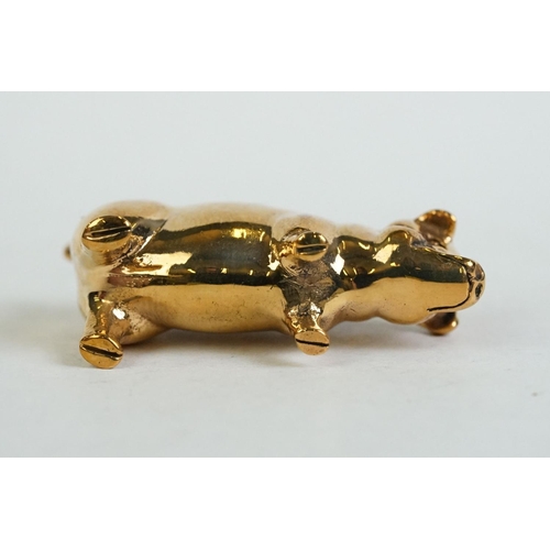 196 - A brass cased pig pincushion