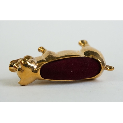 196 - A brass cased pig pincushion