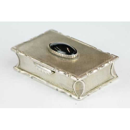 270 - George IV silver snuff box, the engine turned hinged lid set with black onyx oval cabochon, cast sty... 