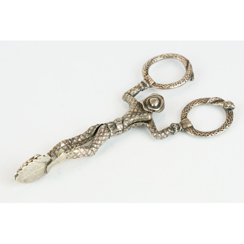 272 - Pair of Victorian silver harlequin sugar nips, the hoops modelled as snakes, makers Henry William Cu... 