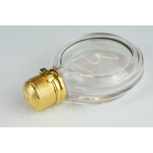 276 - 19th century circular glass scent bottle with yellow metal mounts, original glass stopper, the hinge... 