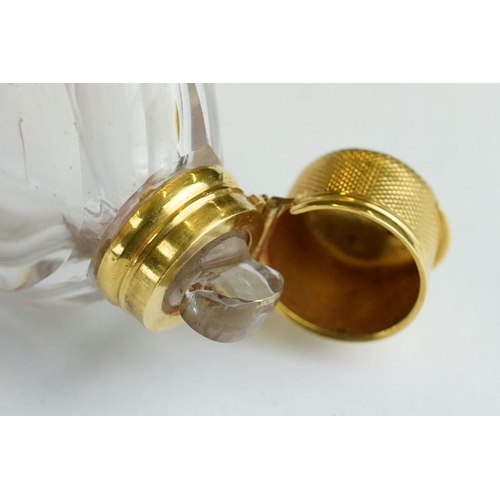 276 - 19th century circular glass scent bottle with yellow metal mounts, original glass stopper, the hinge... 