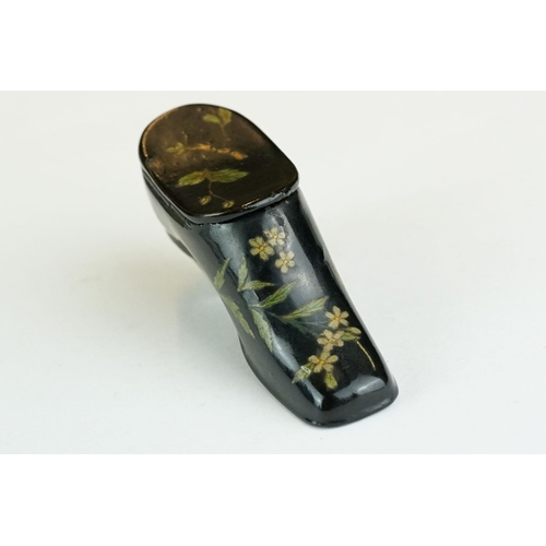 279 - 19th century snuff box modelled as a ladies shoe, lacquered with floral decoration, hinged lid, leng... 