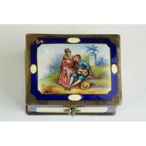 286 - German enamelled silver pill box, the hinged lid depicting a musician serenading his Lady, plain blu... 