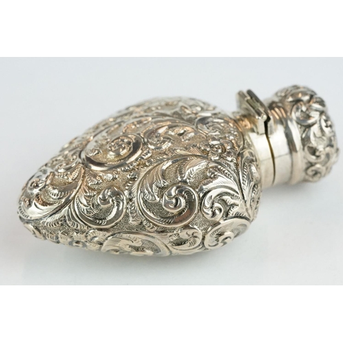 287 - Edwardian silver heart shaped scent bottle, repoussé foliate scroll decoration, blank shield shaped ... 