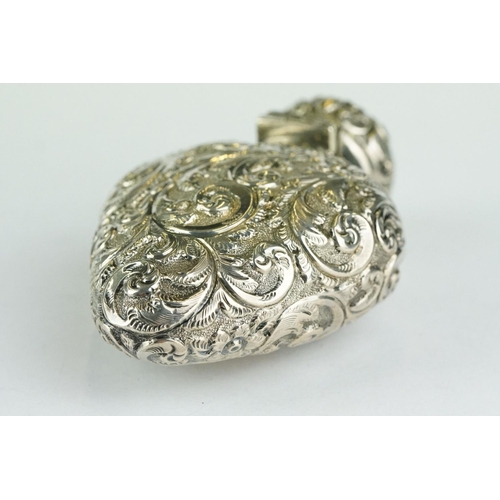 287 - Edwardian silver heart shaped scent bottle, repoussé foliate scroll decoration, blank shield shaped ... 