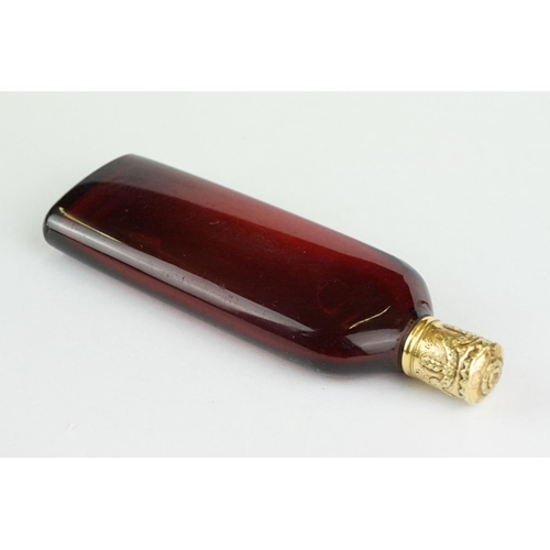 290 - 18th century French lay down ruby glass scent bottle, plain polished tapered body, the yellow and ro... 