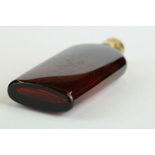 290 - 18th century French lay down ruby glass scent bottle, plain polished tapered body, the yellow and ro... 