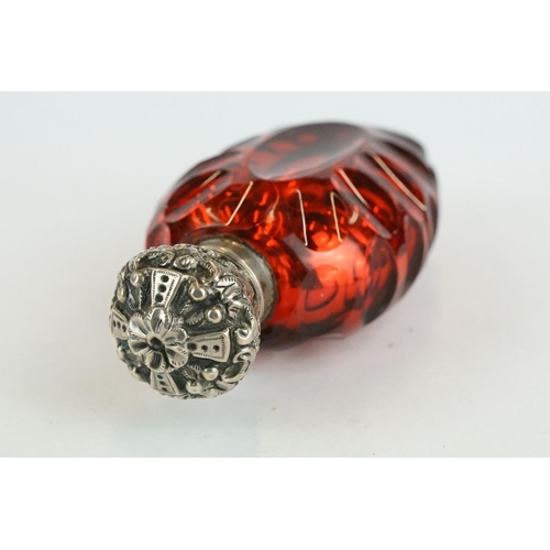 292 - 19th century red mercury glass scent bottle, white metal hinged lid with repoussé decoration, openin... 