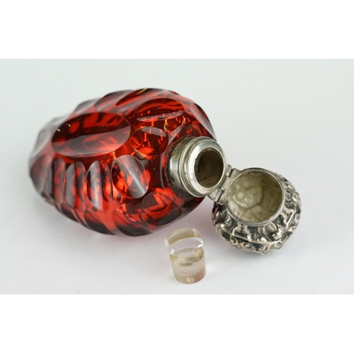 292 - 19th century red mercury glass scent bottle, white metal hinged lid with repoussé decoration, openin... 