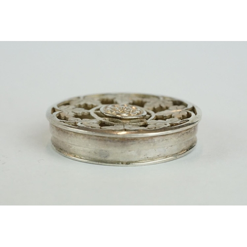 297 - 18th century white metal spice box, circular, pierced lid, ivy leaf decoration with rose to centre, ... 