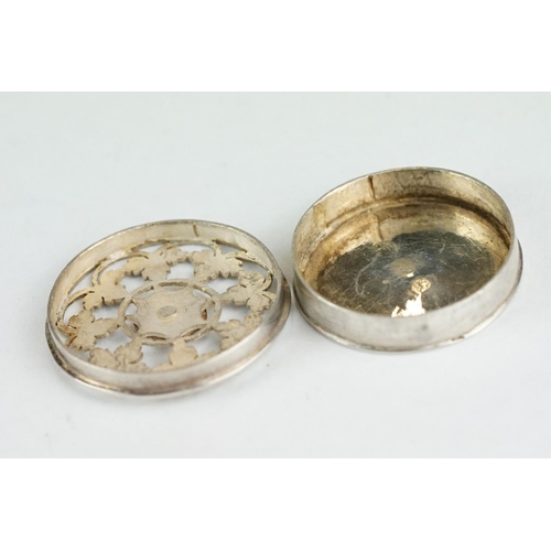 297 - 18th century white metal spice box, circular, pierced lid, ivy leaf decoration with rose to centre, ... 