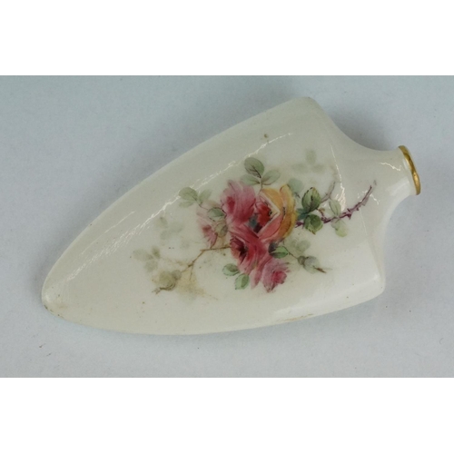 309 - Early 20th century ceramic scent bottle, tapered shield-shaped form with hand painted rose and forge... 