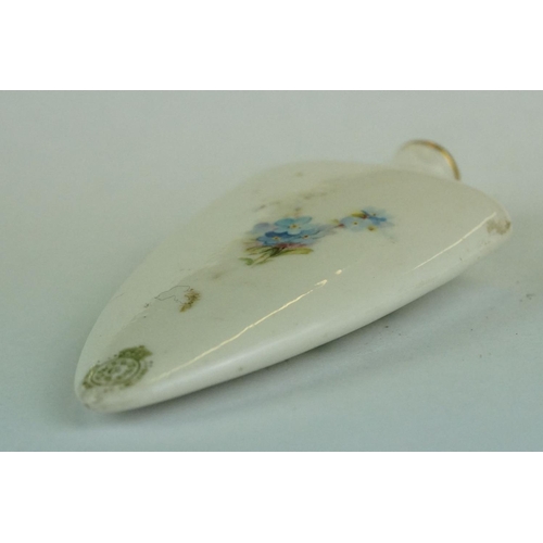 309 - Early 20th century ceramic scent bottle, tapered shield-shaped form with hand painted rose and forge... 