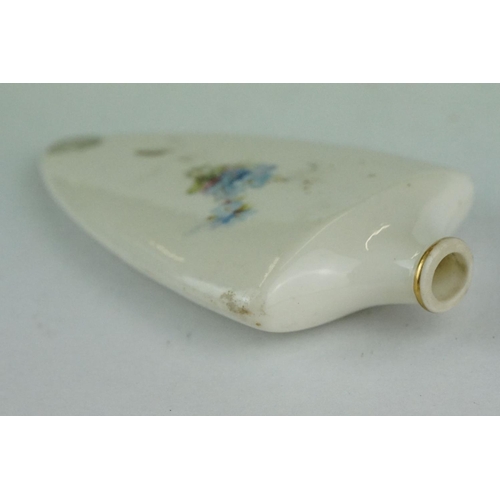 309 - Early 20th century ceramic scent bottle, tapered shield-shaped form with hand painted rose and forge... 