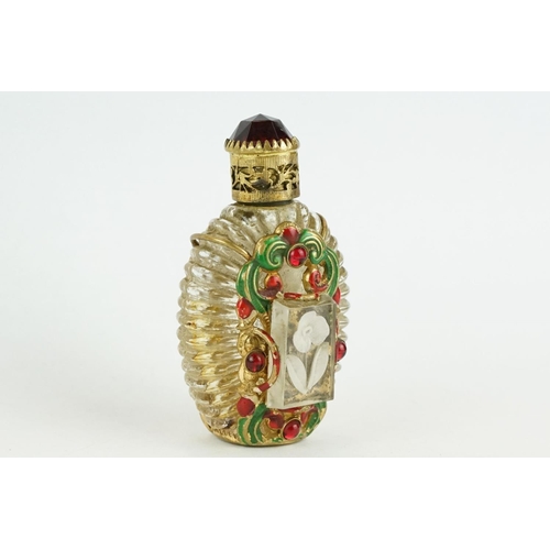 313 - Czechoslovakia glass scent bottle, applied cast metal gilt and painted holder, with red glass caboch... 