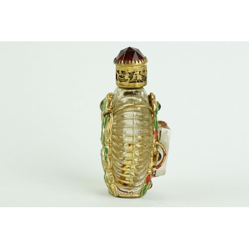 313 - Czechoslovakia glass scent bottle, applied cast metal gilt and painted holder, with red glass caboch... 