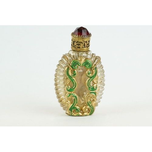 313 - Czechoslovakia glass scent bottle, applied cast metal gilt and painted holder, with red glass caboch... 