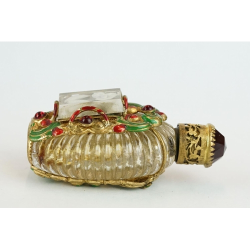 313 - Czechoslovakia glass scent bottle, applied cast metal gilt and painted holder, with red glass caboch... 