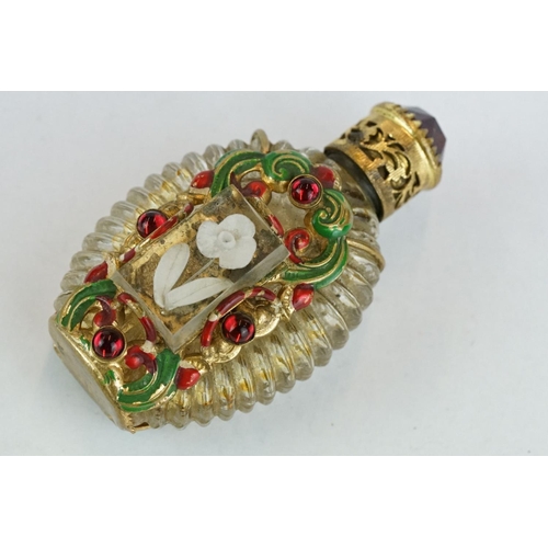 313 - Czechoslovakia glass scent bottle, applied cast metal gilt and painted holder, with red glass caboch... 