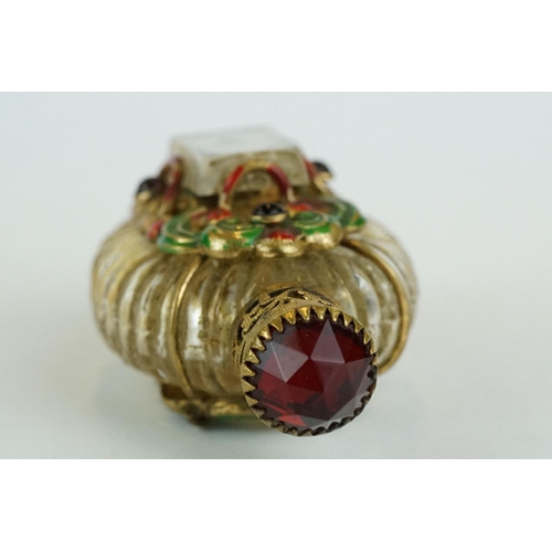 313 - Czechoslovakia glass scent bottle, applied cast metal gilt and painted holder, with red glass caboch... 