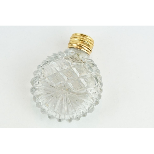 319 - 19th century gold mounted cut glass scent bottle, circular body, original stopper, gold mount and hi... 