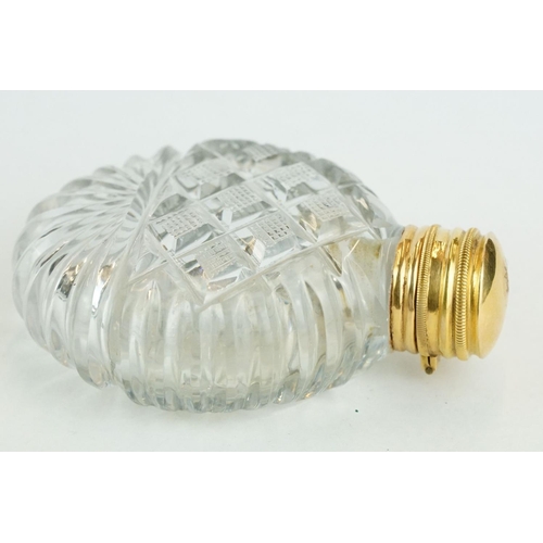 319 - 19th century gold mounted cut glass scent bottle, circular body, original stopper, gold mount and hi... 