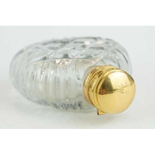 319 - 19th century gold mounted cut glass scent bottle, circular body, original stopper, gold mount and hi... 