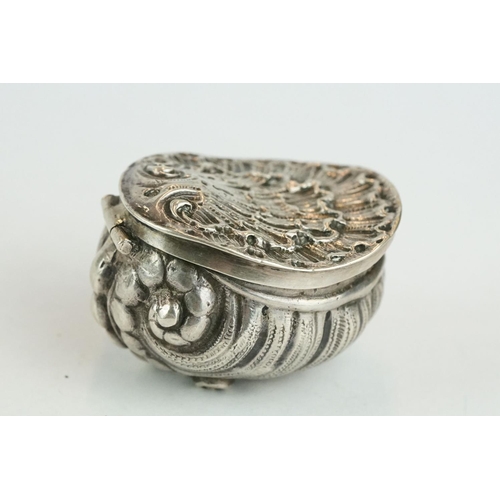 320 - Unmarked silver snuff box modelled as a stylised shell, three cast scroll feet, cast hinged lid, gil... 