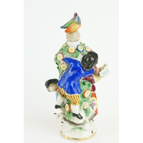 322 - Girl in Swing scent bottle depicting a courting couple amongst a flower bower with another boy and d... 