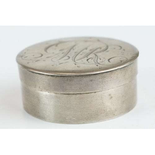 327 - White metal circular pill box, engraved initials to the lid, diameter approx 5.5cm

Provenance: from... 