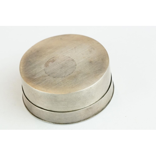 327 - White metal circular pill box, engraved initials to the lid, diameter approx 5.5cm

Provenance: from... 