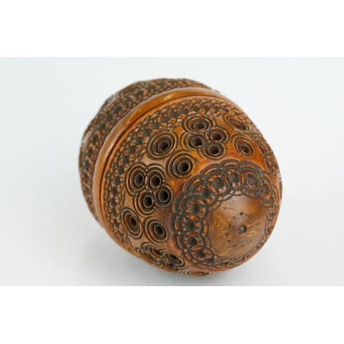 333 - Coquilla nut pomander with carved and pierced repeating circle decoration, length approx 7cm

Proven... 