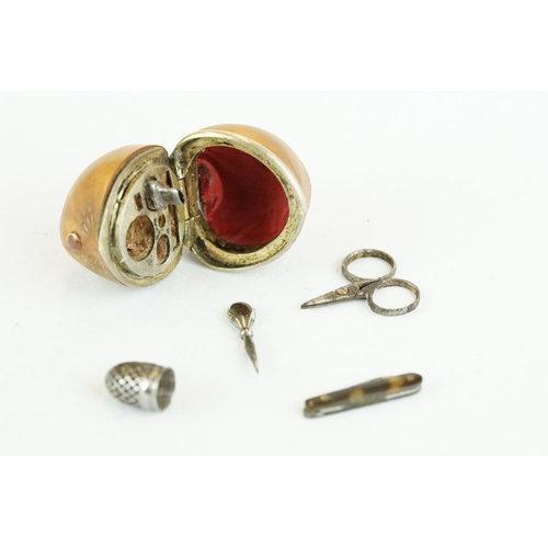 334 - Late 19th century miniature etui contained within a hazlenut, containing miniature scissors, thimble... 