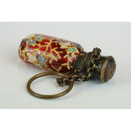 339 - Late 19th century cranberry glass scent bottle with finger chain, circa 1880, with hand painted enam... 