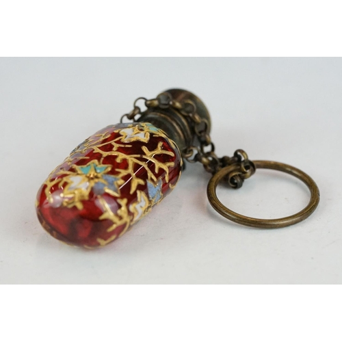 339 - Late 19th century cranberry glass scent bottle with finger chain, circa 1880, with hand painted enam... 