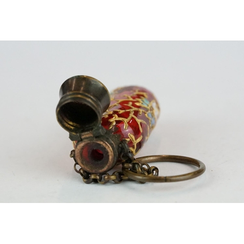 339 - Late 19th century cranberry glass scent bottle with finger chain, circa 1880, with hand painted enam... 