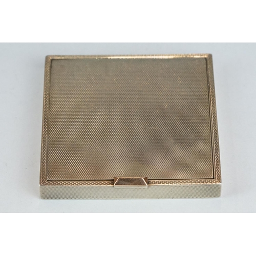 342 - Dunhill silver compact, engine turned hinged lid and body, 14ct rose gold thumb-piece, the lid openi... 