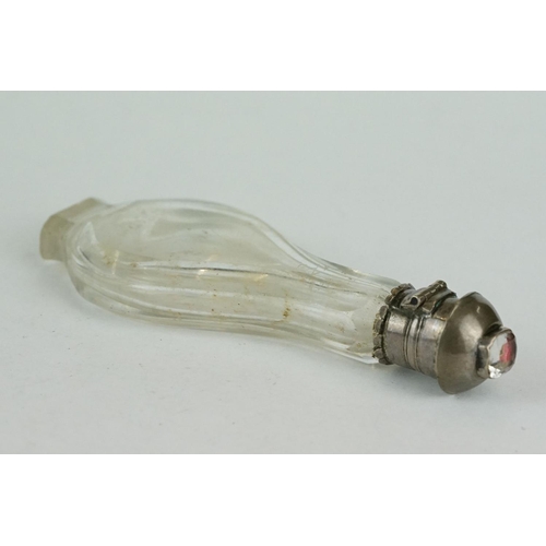 343 - 17th century/ 18th century glass footed scent bottle, white metal hinged lid with faceted crystal fo... 