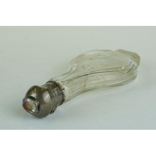 343 - 17th century/ 18th century glass footed scent bottle, white metal hinged lid with faceted crystal fo... 