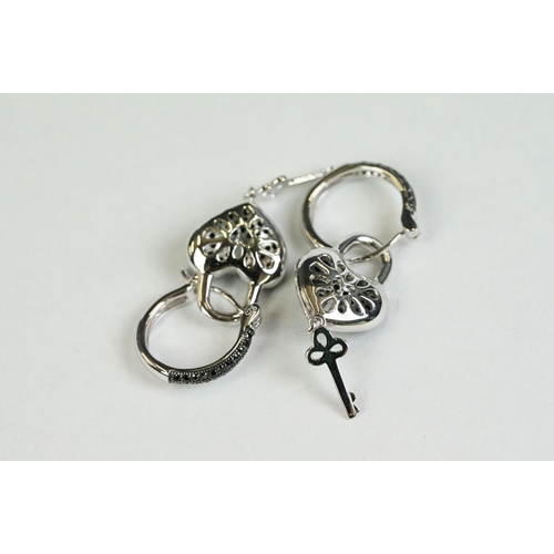 352 - A pair of silver and CZ heart shaped drop earrings, heart and key