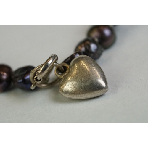 354 - A blister pearl bracelet with silver heart shaped clasp