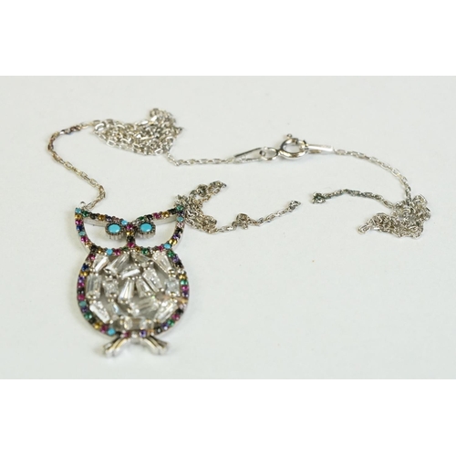 355 - A silver owl shaped necklace set with semi-precious stones