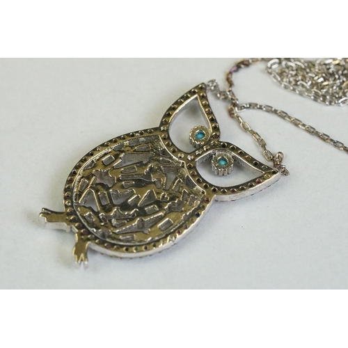 355 - A silver owl shaped necklace set with semi-precious stones