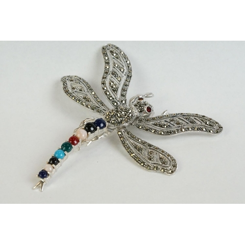 356 - A silver dragonfly brooch set with marcasites, sapphires, rubies etc